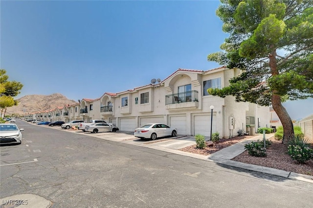 6201 E Lake Mead Blvd Unit 223, Las Vegas, NV 89156 - view of asphalt road featuring a residential view, curbs, street lighting, and sidewalks