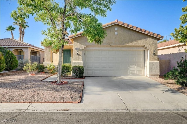 10612 Primrose Arbor Ave, Las Vegas, NV 89144 - mediterranean / spanish-style house with a garage, stucco siding, driveway, and a tiled roof