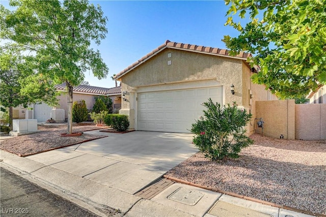 10612 Primrose Arbor Ave, Las Vegas, NV 89144 - mediterranean / spanish-style home featuring an attached garage, concrete driveway, stucco siding, and a tile roof