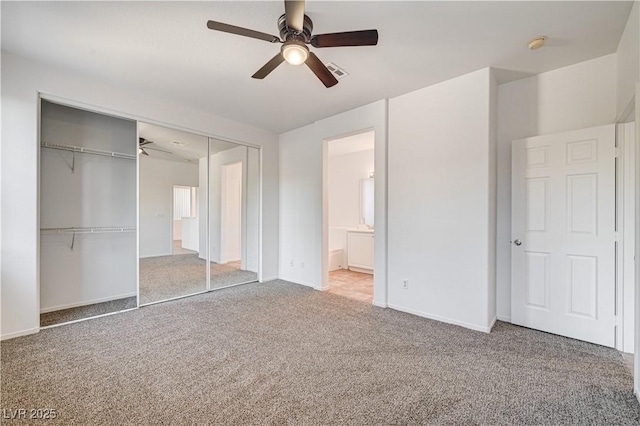 10612 Primrose Arbor Ave, Las Vegas, NV 89144 - unfurnished bedroom with carpet floors, a closet, a ceiling fan, and connected bathroom