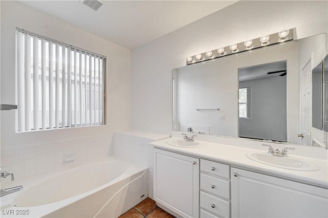 10612 Primrose Arbor Ave, Las Vegas, NV 89144 - full bath featuring double vanity, a bath, and tile patterned flooring