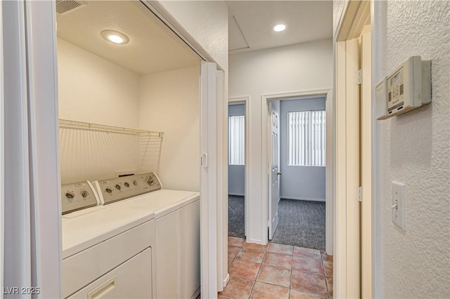 10612 Primrose Arbor Ave, Las Vegas, NV 89144 - laundry room featuring washing machine and clothes dryer, light tile patterned flooring, and light colored carpet
