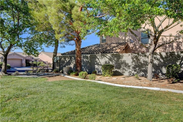 10612 Primrose Arbor Ave, Las Vegas, NV 89144 - view of front of property featuring a front yard, stucco siding, and a tile roof