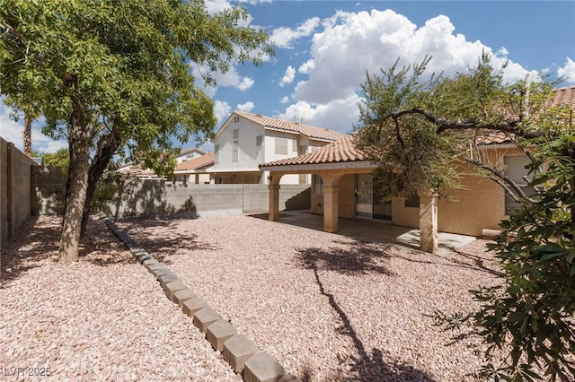 757 Roddenberry Ave, Las Vegas, NV 89123 - rear view of property with a patio area, a fenced backyard, a tile roof, and stucco siding