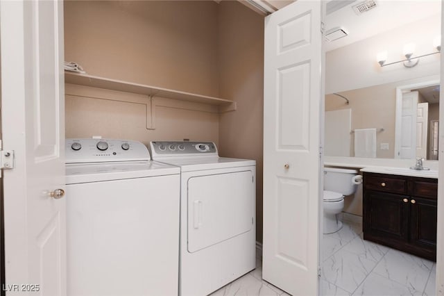 757 Roddenberry Ave, Las Vegas, NV 89123 - laundry area with washing machine and dryer and light marble finish flooring