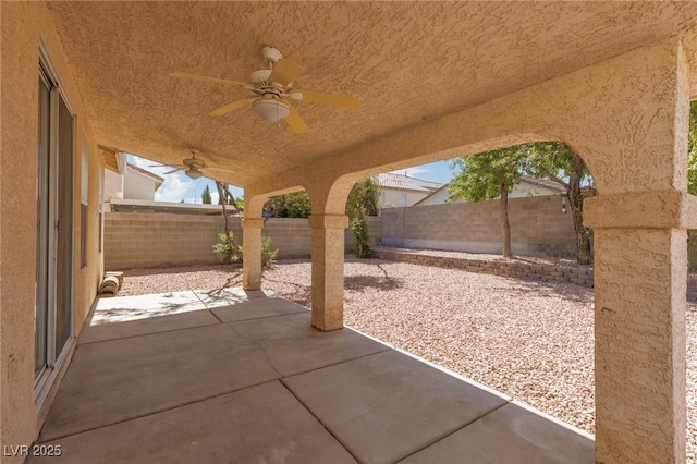 757 Roddenberry Ave, Las Vegas, NV 89123 - fenced backyard with ceiling fan and a patio area