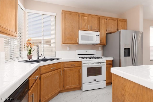 757 Roddenberry Ave, Las Vegas, NV 89123 - kitchen featuring stainless steel appliances, tile countertops, and plenty of natural light