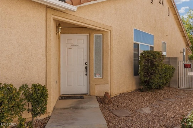 757 Roddenberry Ave, Las Vegas, NV 89123 - view of exterior entry with stucco siding and a gate