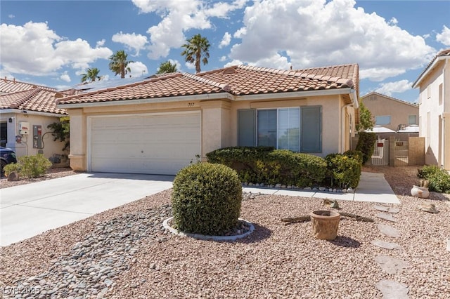 757 Roddenberry Ave, Las Vegas, NV 89123 - mediterranean / spanish-style home with a garage, concrete driveway, stucco siding, and a tile roof
