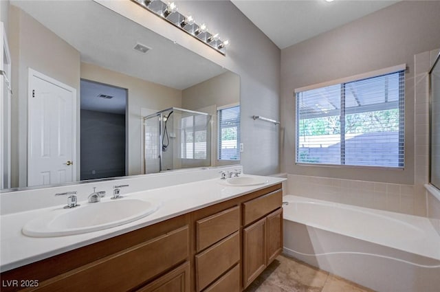 10518 Santerno St, Las Vegas, NV 89141 - full bath featuring a shower stall, a garden tub, double vanity, and tile patterned flooring