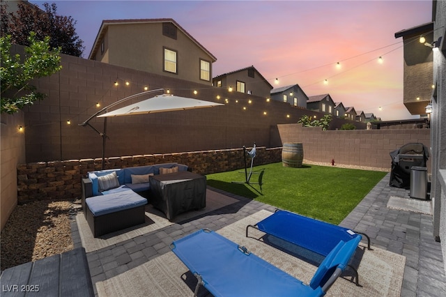 9237 Brayden Bay St, Las Vegas, NV 89178 - fenced backyard featuring a patio, an outdoor living space, and a grill