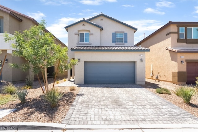 9237 Brayden Bay St, Las Vegas, NV 89178 - mediterranean / spanish house with decorative driveway, stucco siding, a tiled roof, and an attached garage