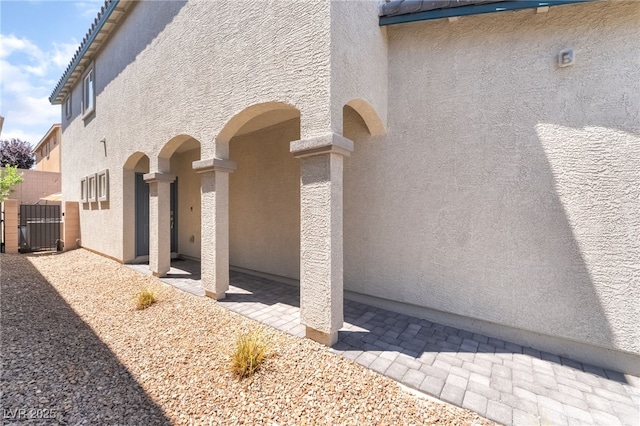 9237 Brayden Bay St, Las Vegas, NV 89178 - view of side of property featuring stucco siding and a tiled roof