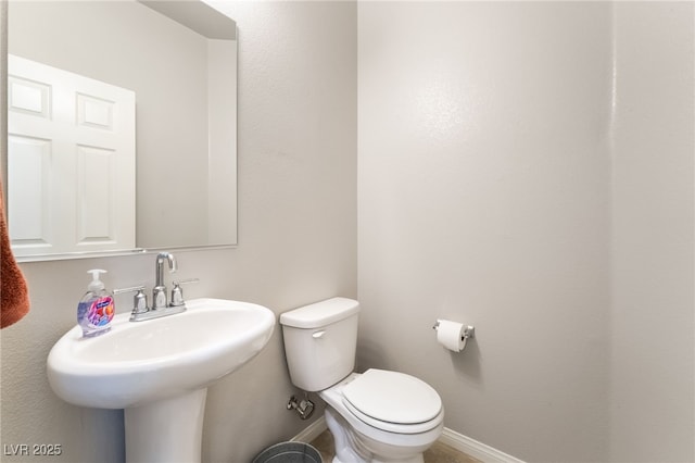 9237 Brayden Bay St, Las Vegas, NV 89178 - half bathroom featuring baseboards