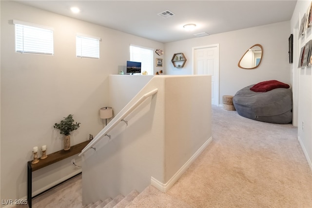 9237 Brayden Bay St, Las Vegas, NV 89178 - hallway with an upstairs landing and light carpet