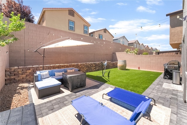 9237 Brayden Bay St, Las Vegas, NV 89178 - fenced backyard featuring a patio, an outdoor hangout area, and area for grilling