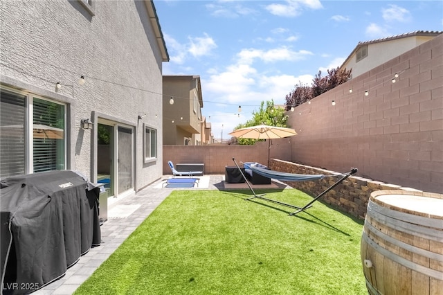 9237 Brayden Bay St, Las Vegas, NV 89178 - fenced backyard with a patio area
