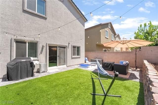 9237 Brayden Bay St, Las Vegas, NV 89178 - back of property featuring stucco siding, outdoor lounge area, and a patio area