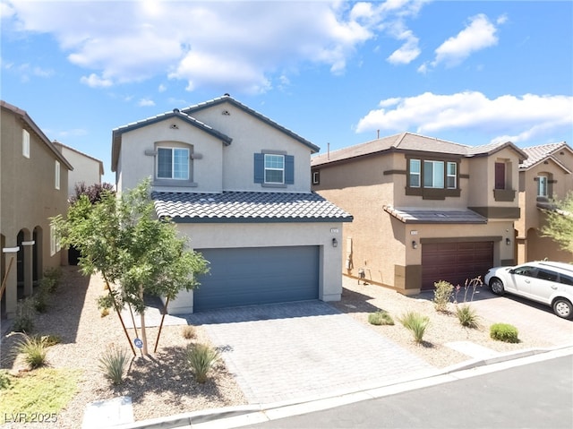 9237 Brayden Bay St, Las Vegas, NV 89178 - mediterranean / spanish-style house with stucco siding, a garage, decorative driveway, and a tile roof