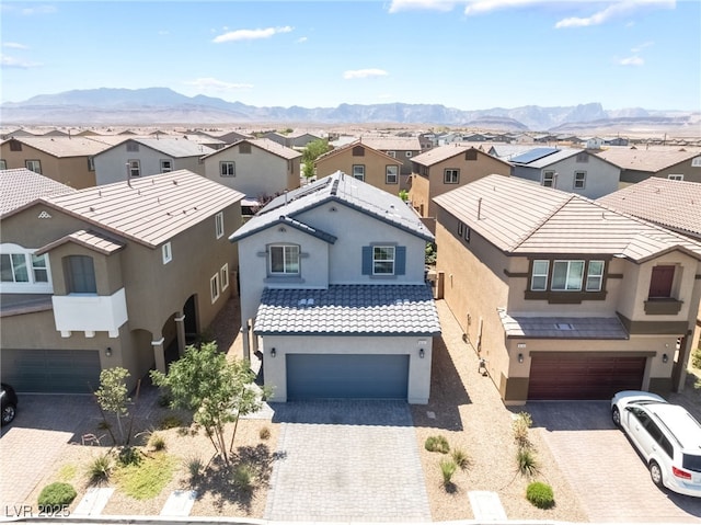 9237 Brayden Bay St, Las Vegas, NV 89178 - view of front of property with a residential view, a garage, and stucco siding
