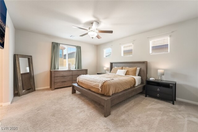 9237 Brayden Bay St, Las Vegas, NV 89178 - bedroom with light colored carpet and a ceiling fan
