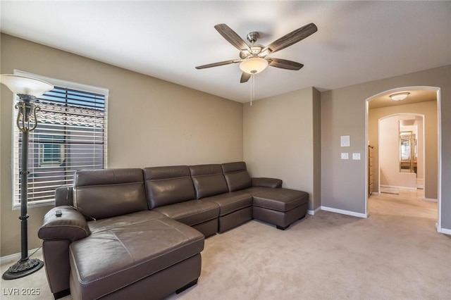 8929 Glenistar Gate Ave, Las Vegas, NV 89143 - living room with arched walkways, ceiling fan, and carpet floors