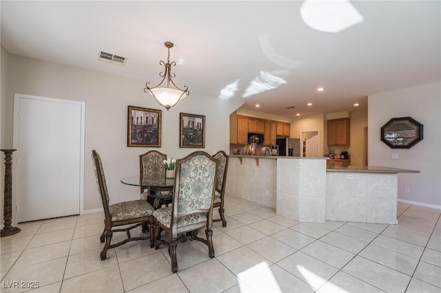 8929 Glenistar Gate Ave, Las Vegas, NV 89143 - dining room with light tile patterned floors and recessed lighting