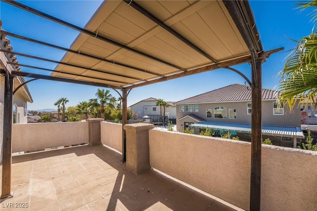 8929 Glenistar Gate Ave, Las Vegas, NV 89143 - view of patio / terrace featuring a pergola and a residential view