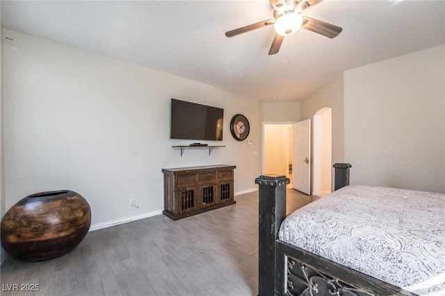 8929 Glenistar Gate Ave, Las Vegas, NV 89143 - bedroom with wood finished floors, ceiling fan, and arched walkways