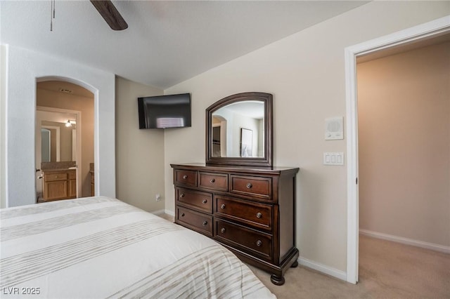 8929 Glenistar Gate Ave, Las Vegas, NV 89143 - bedroom with light colored carpet, arched walkways, and a ceiling fan
