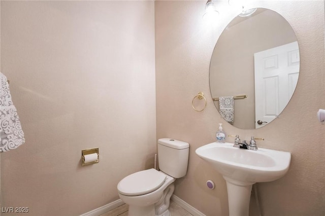 8929 Glenistar Gate Ave, Las Vegas, NV 89143 - bathroom featuring toilet and baseboards