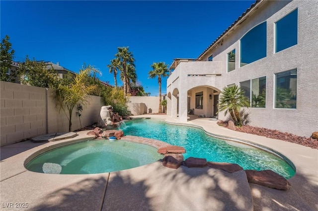 8929 Glenistar Gate Ave, Las Vegas, NV 89143 - view of pool with a pool with connected hot tub, a fenced backyard, and a patio area