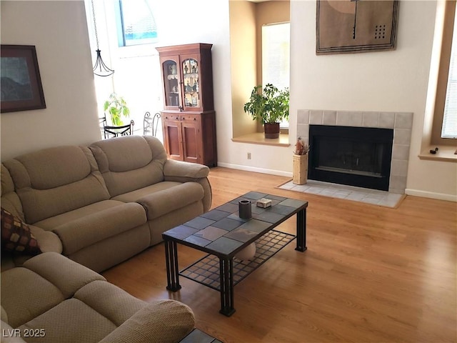 4816 Fiesta Lakes St, Las Vegas, NV 89130 - living area with light wood-style flooring and a fireplace