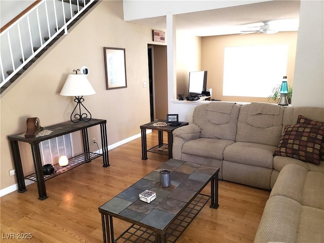 4816 Fiesta Lakes St, Las Vegas, NV 89130 - living room with wood finished floors, a ceiling fan, and stairway