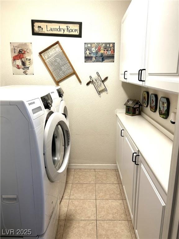4816 Fiesta Lakes St, Las Vegas, NV 89130 - washroom with cabinet space, washer and dryer, and light tile patterned floors