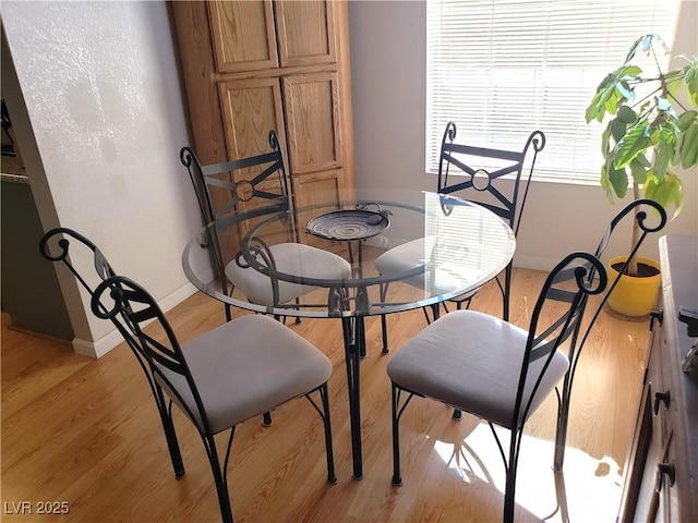4816 Fiesta Lakes St, Las Vegas, NV 89130 - dining area with light wood-style floors and baseboards