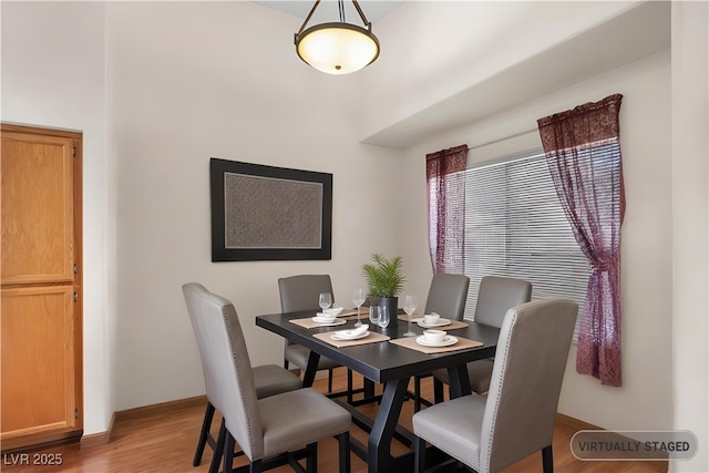 350 S Durango Dr Unit 202, Las Vegas, NV 89145 - dining room featuring wood finished floors and baseboards