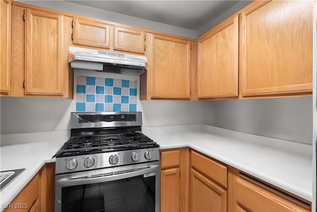 350 S Durango Dr Unit 202, Las Vegas, NV 89145 - kitchen with stainless steel range with gas stovetop, under cabinet range hood, light countertops, light brown cabinetry, and tasteful backsplash