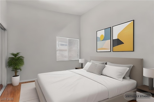 350 S Durango Dr Unit 202, Las Vegas, NV 89145 - bedroom featuring wood finished floors and baseboards