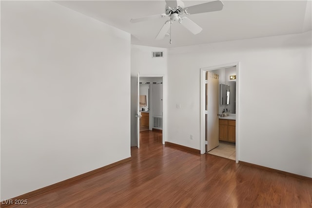 350 S Durango Dr Unit 202, Las Vegas, NV 89145 - unfurnished bedroom featuring wood finished floors and ceiling fan