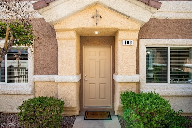 1155 Heavenly Harvest Pl Unit 3, Henderson, NV 89002 - doorway to property with stucco siding