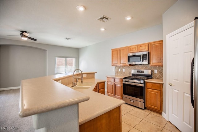 1155 Heavenly Harvest Pl Unit 3, Henderson, NV 89002 - kitchen with appliances with stainless steel finishes, light countertops, decorative backsplash, ceiling fan, and recessed lighting