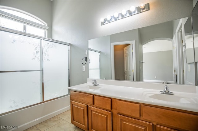 1155 Heavenly Harvest Pl Unit 3, Henderson, NV 89002 - full bath with double vanity, tile patterned floors, and combined bath / shower with glass door