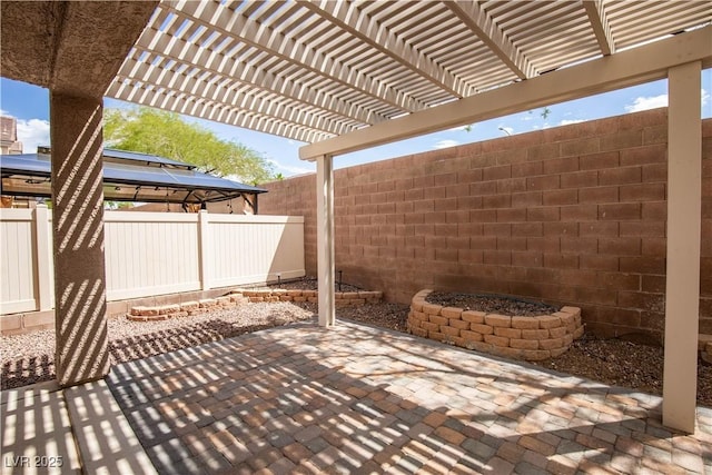 1155 Heavenly Harvest Pl Unit 3, Henderson, NV 89002 - fenced backyard with a gazebo, a patio, and a pergola