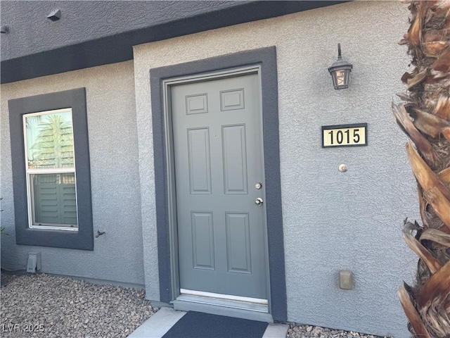 9050 W Tropicana Ave Unit 1015, Las Vegas, NV 89147 - entrance to property with stucco siding