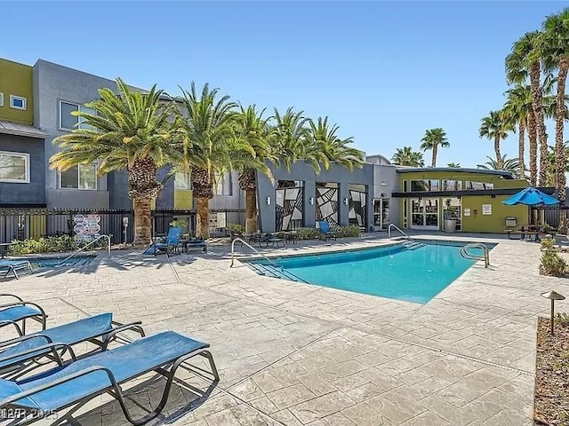 9050 W Tropicana Ave Unit 1015, Las Vegas, NV 89147 - community pool with a patio area