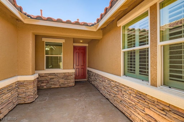 193 Lynbrook St, Henderson, NV 89012 - view of exterior entry featuring stucco siding and stone siding