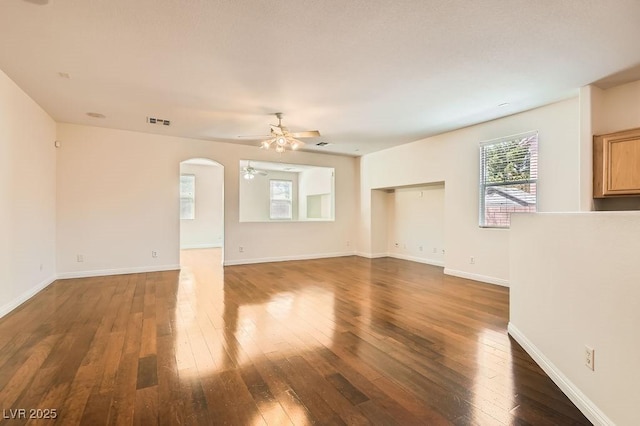 193 Lynbrook St, Henderson, NV 89012 - unfurnished living room featuring a ceiling fan, healthy amount of natural light, and hardwood / wood-style floors