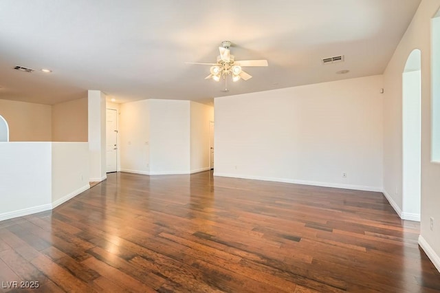 193 Lynbrook St, Henderson, NV 89012 - empty room with a ceiling fan, dark wood-type flooring, arched walkways, and recessed lighting
