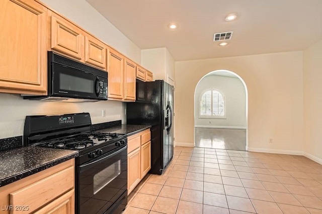 193 Lynbrook St, Henderson, NV 89012 - kitchen with black appliances, light brown cabinets, arched walkways, light tile patterned flooring, and recessed lighting